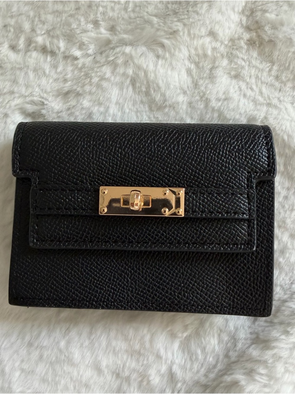 Compact Black Leather Wallet with Gold Turn-Lock Accent